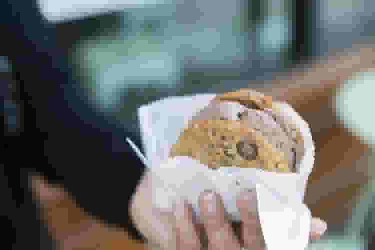 woman holding a cookie for a girls night dessert party