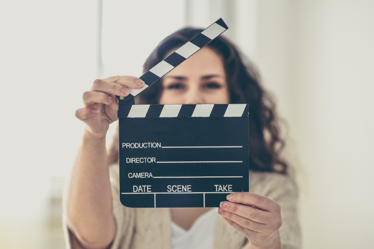 woman holding film cue marker