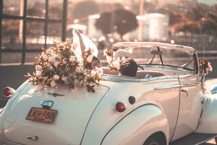 A white Antique Car for this wedding theme.