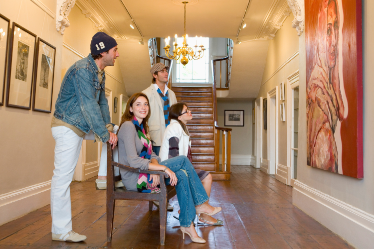 couples viewing art in gallery