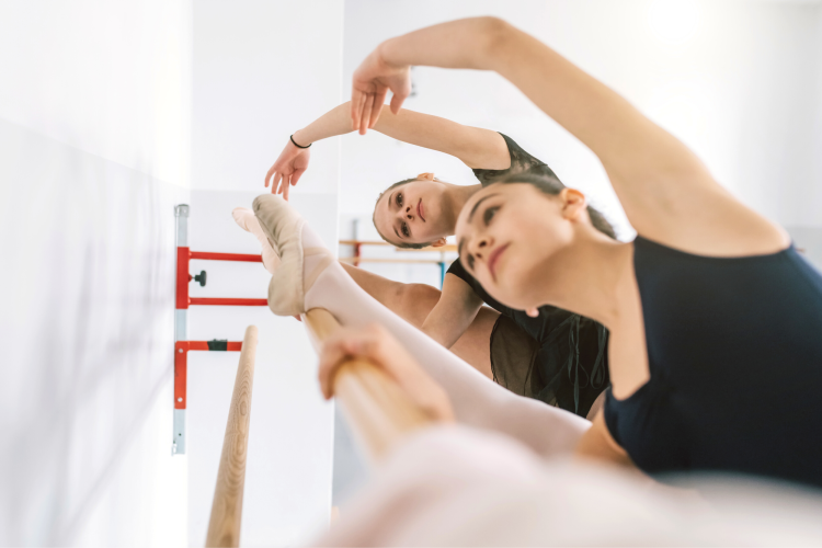 ballerinas doing a side stretch