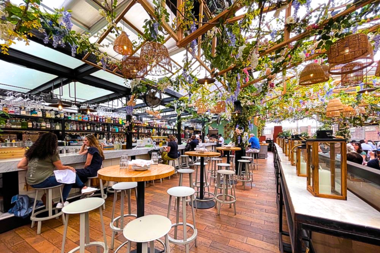 This flower filled rooftop bar in NYC is Italian-themed,