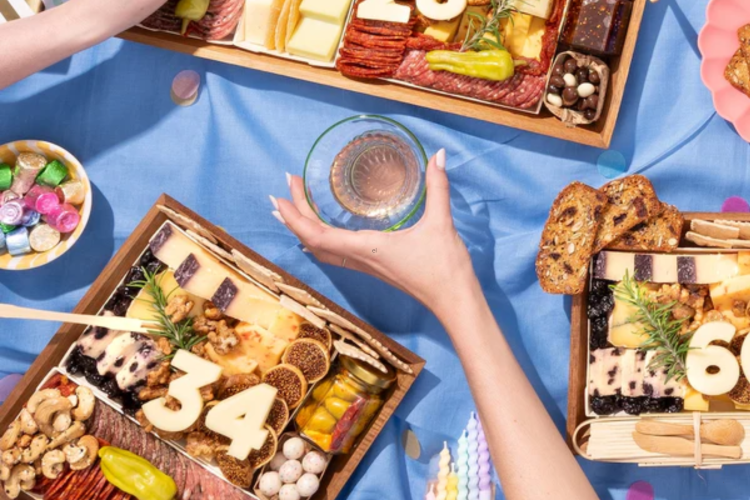 boarderie charcuterie boards with ages carved out of cheese