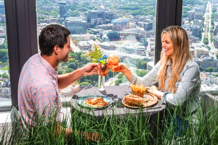 Have food and a drink at this rooftop restaurant in Boston.