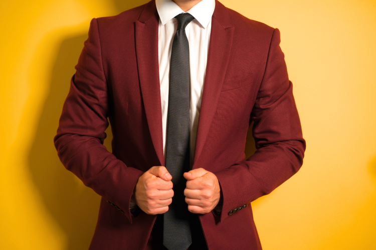 A deep Burgundy suit makes for a perfect summer wedding color.
