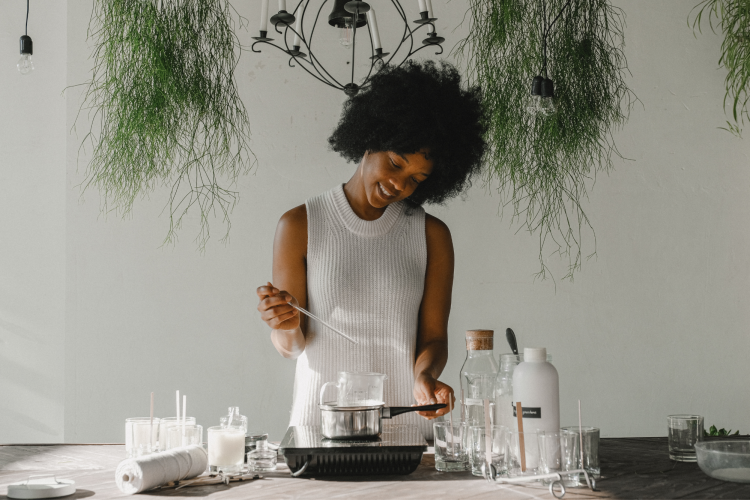 woman making homemade candles