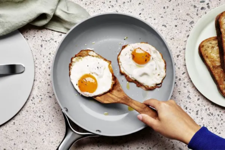 blue sauté pan cooking eggs as unique father's day gift