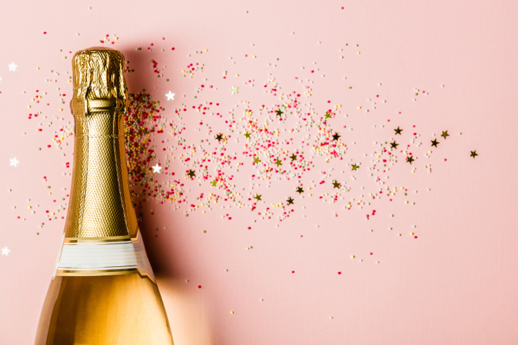 pink bottle of Champagne on silver glitter