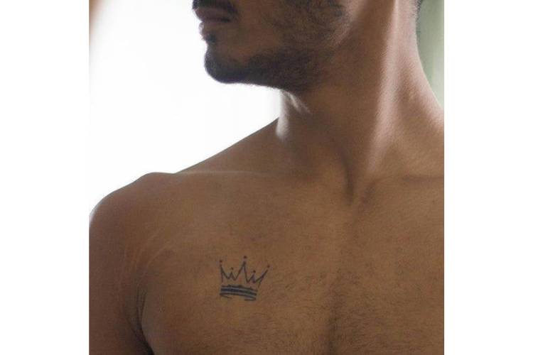 Man with crown tattoo