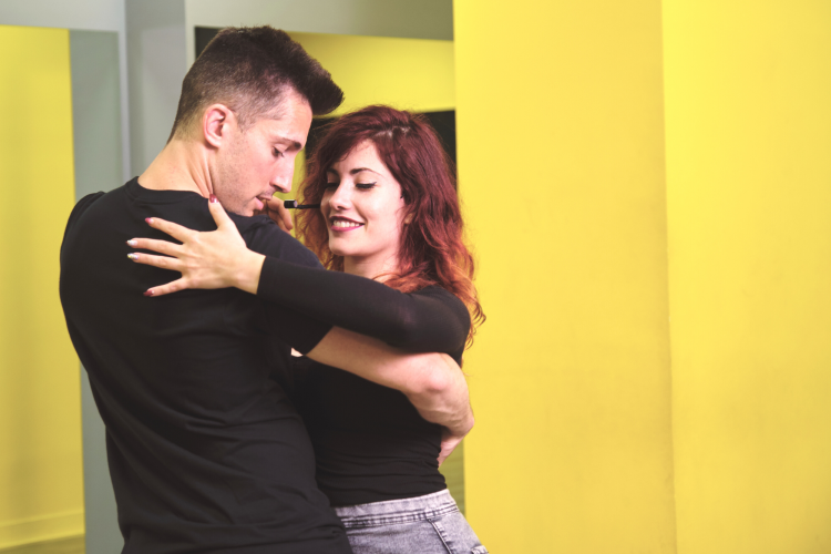 two dance teachers dancing together in class