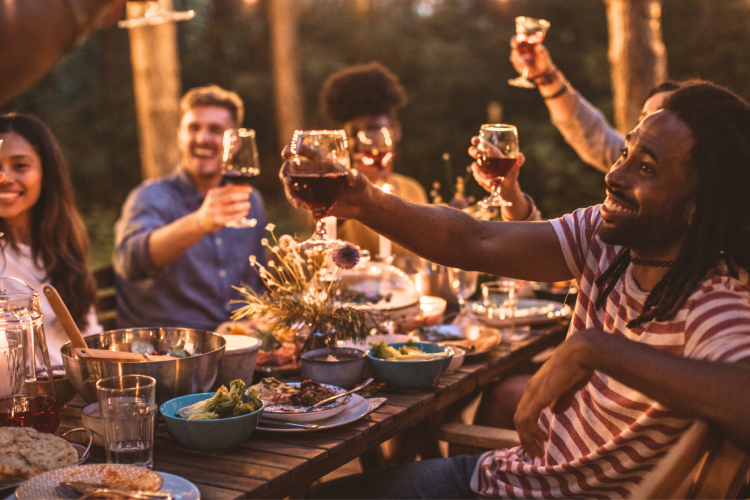 friends cheers at dinner party