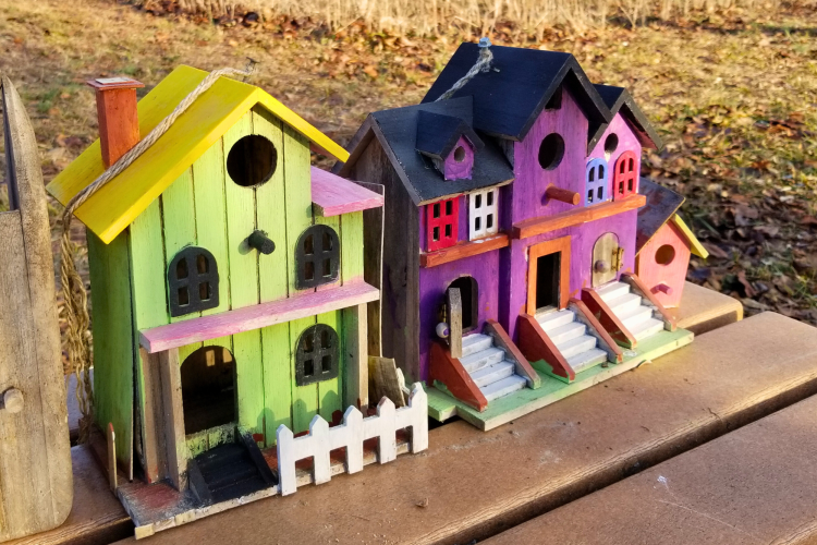 colorful birdhouses that look like real houses