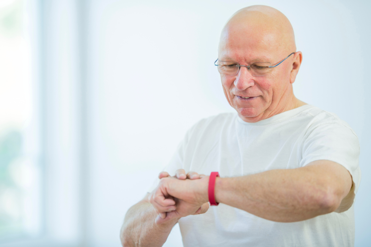 man checking fitness tracker