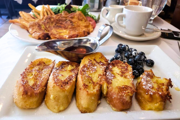 Order French toast with syrup and blueberries at this french restaurant in boston