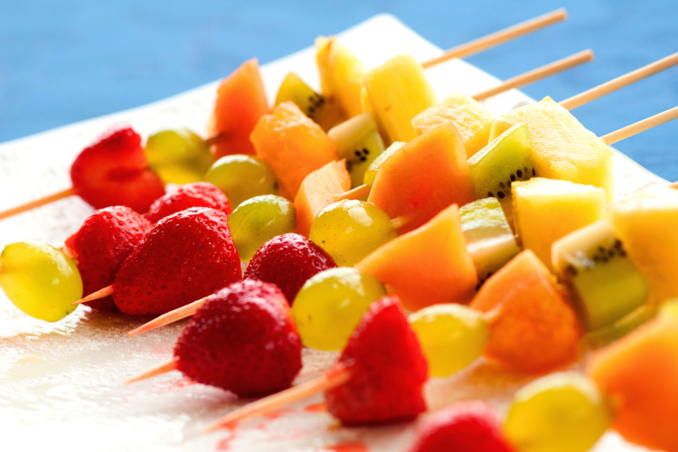 A healthy wedding food idea is to serve fruit skewers.