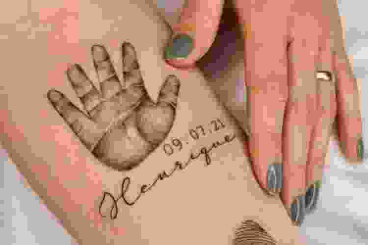 Baby handprint tattoo