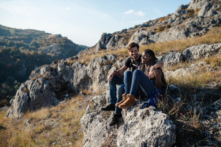 couple enjoying view from mountain hike