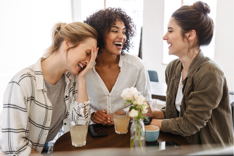 Women laughing at hilarious jokes for adults
