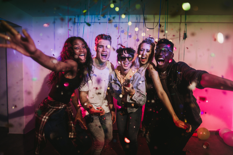 teens dancing in living room
