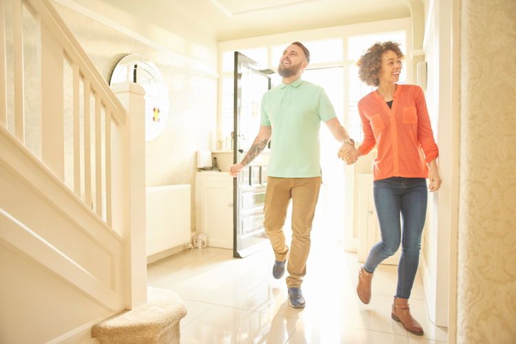 new homeowners walking into entryway