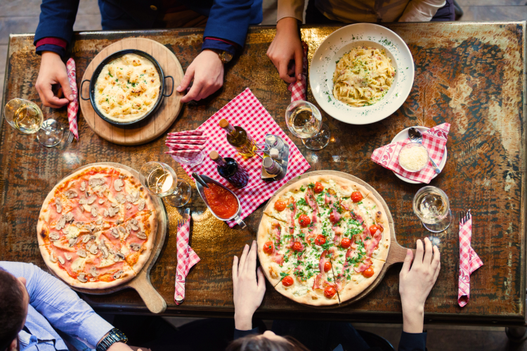 People enjoying pizza and pasta from a restaurant in back bay, boston