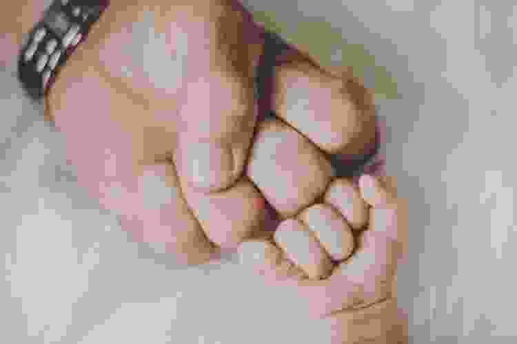 Baby and Dad's fist pump