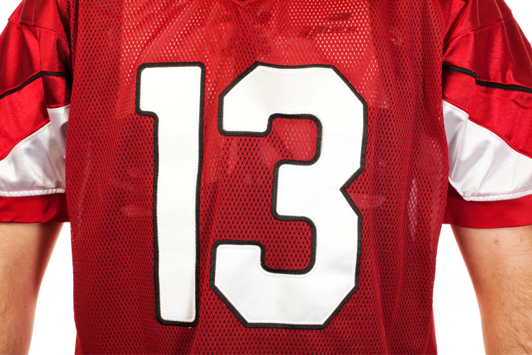 man wearing numner 13 on reed football jersey