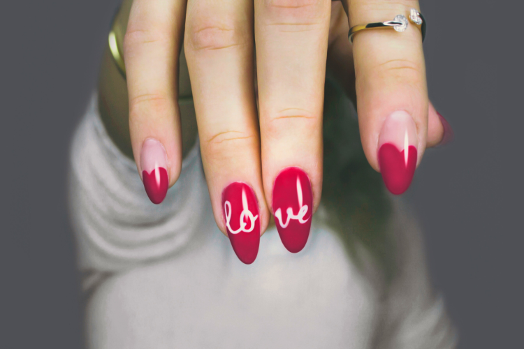 These pink Valentine's nails also spell out LOVE in white