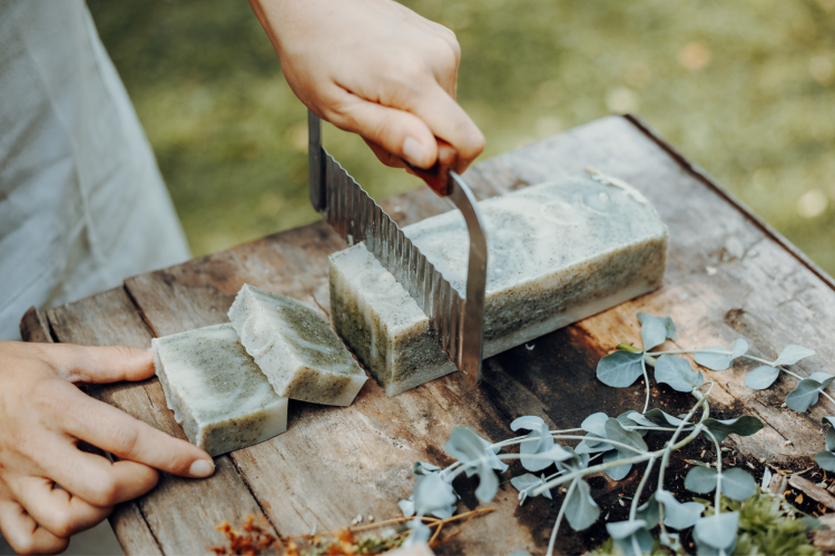 slicing handmade soap into bars