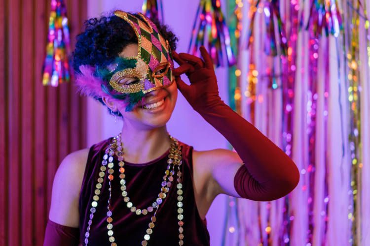 woman dancing wearing masquerade mask