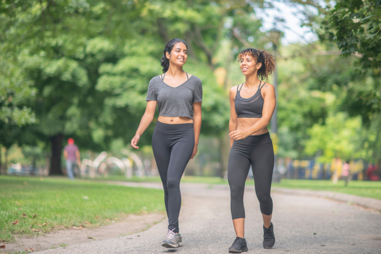 two friends walking in the park