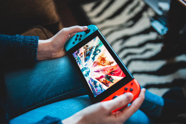 playing Nintendo switch on the couch