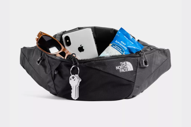 northface belt carrying keys, sunglasses, coins, etc.