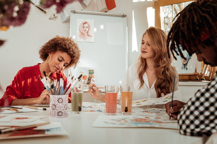 women painting together