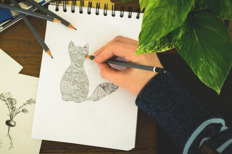 hand drawing doodle of cat in notebook
