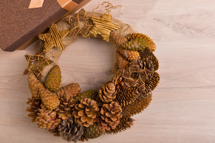 wreath made of twigs, pinecones and dried autumn leaves