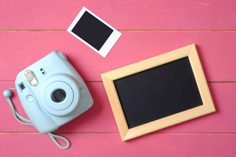 polaroid camera and blank photos