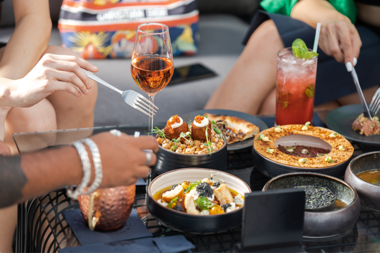 restaurant gift card and friends eating at table
