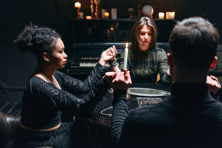 group of friends having a Halloween seance