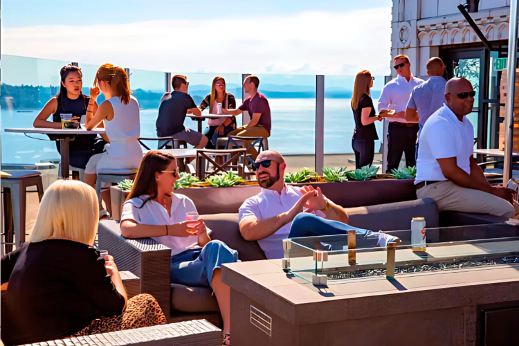 Experience a fun atmosphere with friends at this rooftop bar in Seattle.