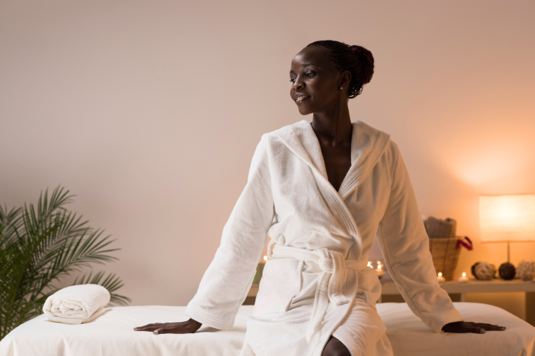 woman relaxing in robe at the spa