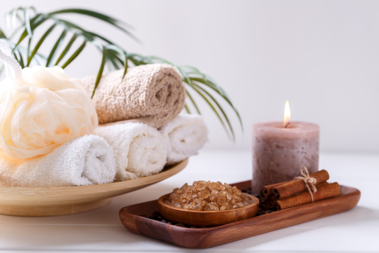 basket of spa items, including soap, bath bombs and candles