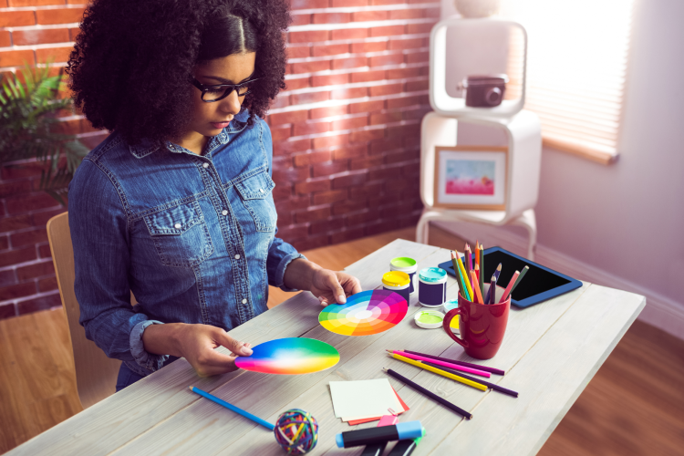 young woman studying the color wheel