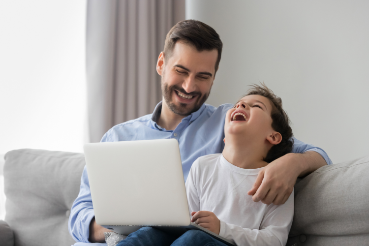 father and son laughing at stupid dad jokes