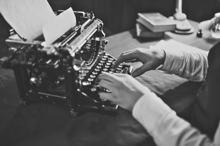 typing on typewriter black and white