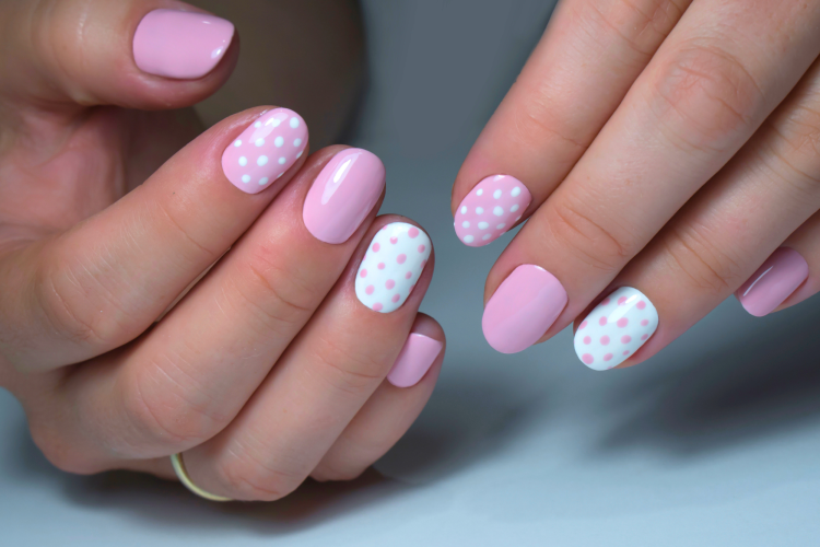 White Nails With Pink Polka Dots are a cute Valentine's nail idea.