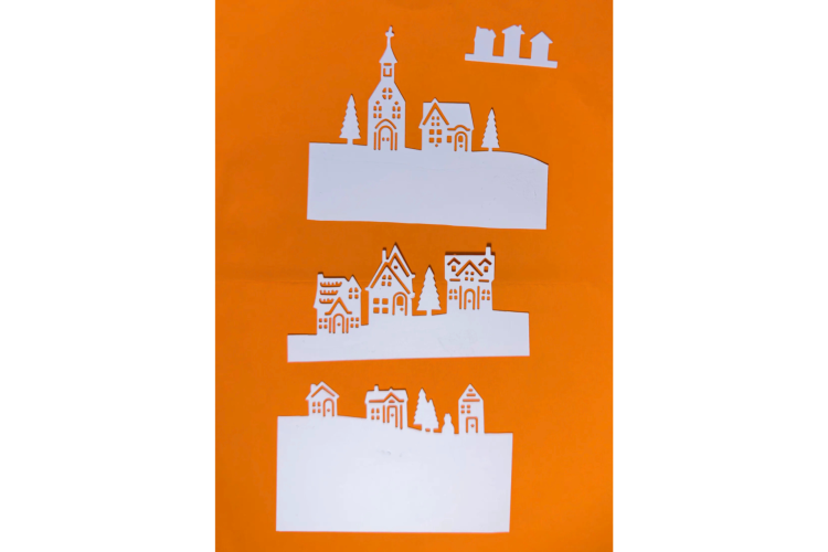Winter village scene paper cut outs