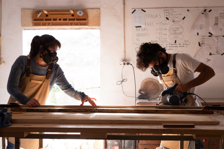 couple building something in woodshop