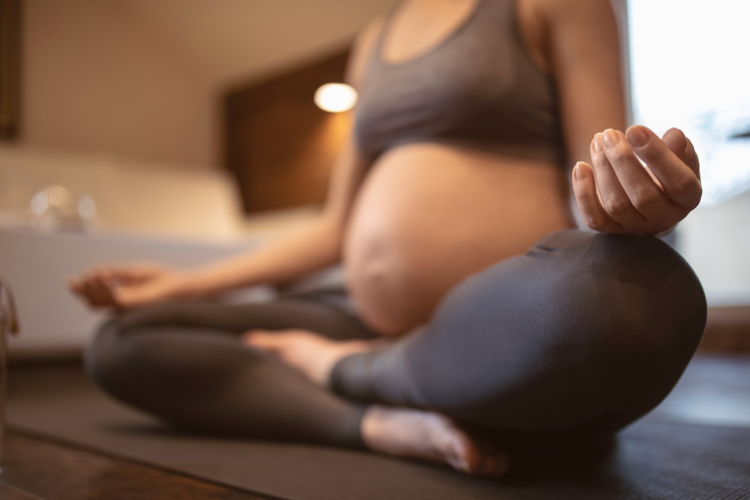 Woman in prenatal yoga class