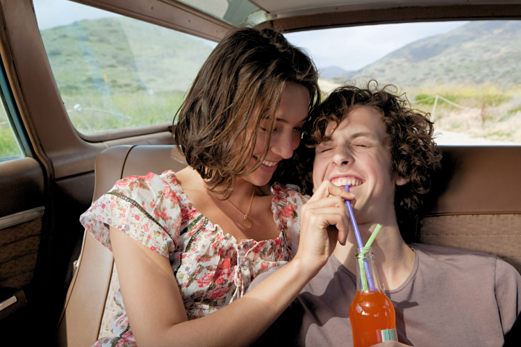 Young couple sharing a soda